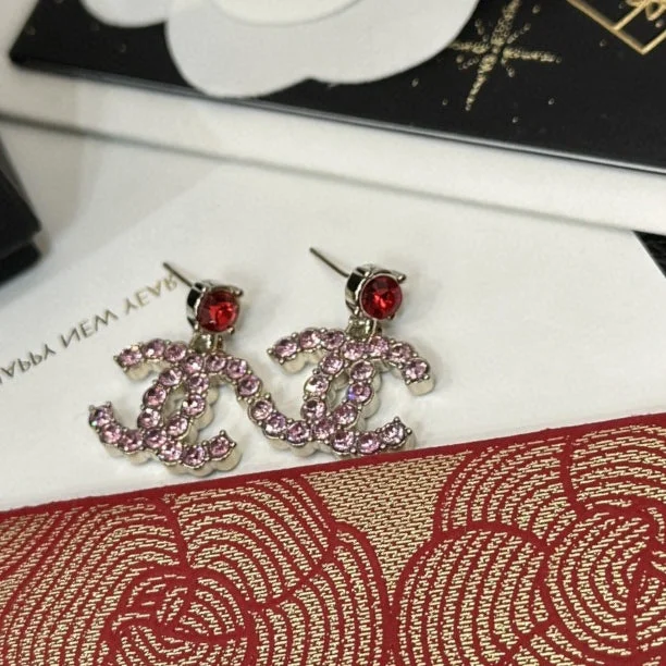 Chanel Stacking colorful treasures to form flower shaped letters earrings